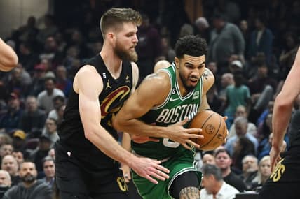 Nov 2, 2022; Cleveland, Ohio, USA; Boston Celtics forward Jayson Tatum (0) drives to the basket against Cleveland Cavaliers forward Dean Wade (32) during the first half at Rocket Mortgage FieldHouse. Mandatory Credit: Ken Blaze-USA TODAY Sports