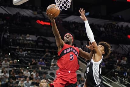 Nov 2, 2022; San Antonio, Texas, USA; Toronto Raptors forward Precious Achiuwa (5) drives to the basket against San Antonio Spurs forward Dominick Barlow (26) during the second half at AT&T Center. Mandatory Credit: Scott Wachter-USA TODAY Sports