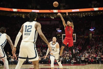 Nov 2, 2022; Portland, Oregon, USA; Portland Trail Blazers guard Anfernee Simons (1) shoots a three point shot against Memphis Grizzlies forward Dillon Brooks (24) during the first half at Moda Center. Mandatory Credit: Troy Wayrynen-USA TODAY Sports