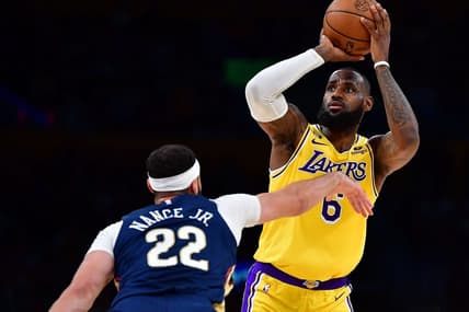 Nov 2, 2022; Los Angeles, California, USA; Los Angeles Lakers forward LeBron James (6) shoots against New Orleans Pelicans forward Larry Nance Jr. (22) during the first half at Crypto.com Arena. Mandatory Credit: Gary A. Vasquez-USA TODAY Sports