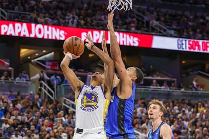 Nov 3, 2022; Orlando, Florida, USA; Golden State Warriors center James Wiseman (33) goes to the basket in front of Orlando Magic guard Jalen Suggs (4) during the second quarter at Amway Center. Mandatory Credit: Mike Watters-USA TODAY Sports
