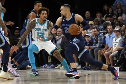 Nov 4, 2022; Memphis, Tennessee, USA; Memphis Grizzlies forward Dillon Brooks (24) dribbles as Charlotte Hornets guard Kelly Oubre Jr. (12) defends during the first half at FedExForum. Mandatory Credit: Petre Thomas-USA TODAY Sports