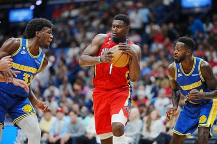 Nov 4, 2022; New Orleans, Louisiana, USA; New Orleans Pelicans forward Zion Williamson (1) recovers the ball against Golden State Warriors center James Wiseman (33) during the first quarter at Smoothie King Center. Mandatory Credit: Andrew Wevers-USA TODAY Sports