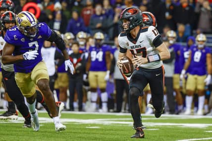 Nov 4, 2022; Seattle, Washington, USA; Oregon State Beavers quarterback Ben Gulbranson (17) scrambles away from Washington Huskies defensive lineman Jeremiah Martin (3) during the first quarter at Alaska Airlines Field at Husky Stadium. Mandatory Credit: Joe Nicholson-USA TODAY Sports