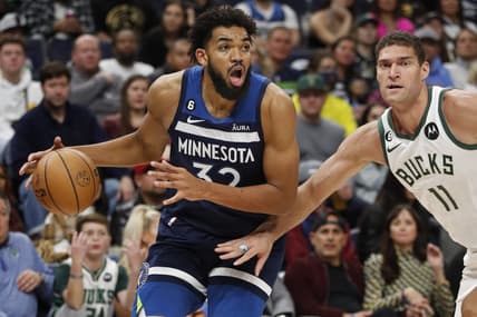 Nov 4, 2022; Minneapolis, Minnesota, USA; Minnesota Timberwolves center Karl-Anthony Towns (32) works around Milwaukee Bucks center Brook Lopez (11) in the third quarter at Target Center. Mandatory Credit: Bruce Kluckhohn-USA TODAY Sports