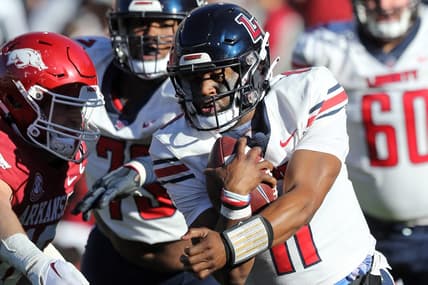 Nov 5, 2022; Fayetteville, Arkansas, USA; Liberty Flames quarterback Johnathan Bennett (11) rushes in the second quarter against the Arkansas Razorbacks at Donald W. Reynolds Razorback Stadium. Mandatory Credit: Nelson Chenault-USA TODAY Sports