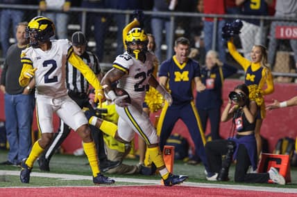 Nov 5, 2022; Piscataway, New Jersey, USA; Michigan Wolverines linebacker Michael Barrett (23) returns an interception for a touchdown during the second half against the Rutgers Scarlet Knights at SHI Stadium. Mandatory Credit: Vincent Carchietta-USA TODAY Sports