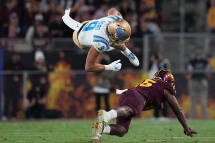 Nov 5, 2022; Tempe, Arizona, USA; Arizona State Sun Devils quarterback Daylin McLemore (15) tackles UCLA Bruins wide receiver Jake Bobo (9) during the first half at Sun Devil Stadium. Mandatory Credit: Joe Camporeale-USA TODAY Sports