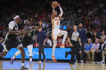 Nov 7, 2022; Atlanta, Georgia, USA; Atlanta Hawks guard Dejounte Murray (5) shoots against the Milwaukee Bucks in the first quarter at State Farm Arena. Mandatory Credit: Brett Davis-USA TODAY Sports