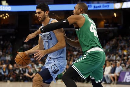 Nov 7, 2022; Memphis, Tennessee, USA; Memphis Grizzlies forward Santi Aldama (7) spins toward the basket as Boston Celtics center Al Horford (42) defends during the first half at FedExForum. Mandatory Credit: Petre Thomas-USA TODAY Sports