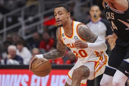 Nov 7, 2022; Atlanta, Georgia, USA; Atlanta Hawks forward John Collins (20) drives to the basket against the Milwaukee Bucks in the second quarter at State Farm Arena. Mandatory Credit: Brett Davis-USA TODAY Sports