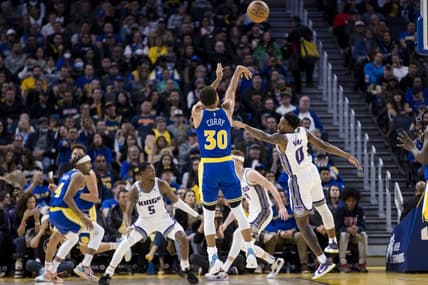 Nov 7, 2022; San Francisco, California, USA; Golden State Warriors guard Stephen Curry (30) takes a three-point shot over Sacramento Kings guard Malik Monk (0) during the first half at Chase Center. Mandatory Credit: John Hefti-USA TODAY Sports