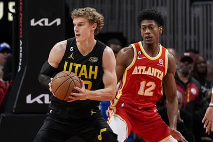 Nov 9, 2022; Atlanta, Georgia, USA; Utah Jazz forward Lauri Markkanen (23) handles the ball in front off Atlanta Hawks forward De'Andre Hunter (12) during the first half at State Farm Arena. Mandatory Credit: Dale Zanine-USA TODAY Sports