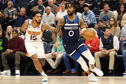 Nov 9, 2022; Minneapolis, Minnesota, USA; Minnesota Timberwolves guard D'Angelo Russell (0) dribbles the ball while Phoenix Suns guard Cameron Payne (15) defends during the first quarter at Target Center. Mandatory Credit: Matt Krohn-USA TODAY Sports