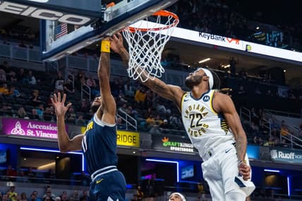 Nov 9, 2022; Indianapolis, Indiana, USA; Indiana Pacers forward Isaiah Jackson (22) and Denver Nuggets forward Bruce Brown (11) fight for a rebound in the second quarter at Gainbridge Fieldhouse. Mandatory Credit: Trevor Ruszkowski-USA TODAY Sports