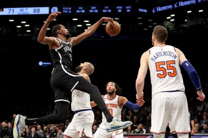 Nov 9, 2022; Brooklyn, New York, USA; Brooklyn Nets forward Kevin Durant (7) fights for the ball against New York Knicks guard Evan Fournier (13) and guard Jalen Brunson (11) and center Isaiah Hartenstein (55) during the third quarter at Barclays Center. Mandatory Credit: Brad Penner-USA TODAY Sports