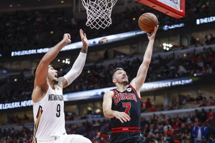 Nov 9, 2022; Chicago, Illinois, USA; Chicago Bulls guard Goran Dragic (7) goes to the basket against New Orleans Pelicans center Willy Hernangomez (9) during the first half at United Center. Mandatory Credit: Kamil Krzaczynski-USA TODAY Sports