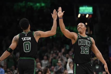 Nov 11, 2022; Boston, Massachusetts, USA;  Boston Celtics forward Jayson Tatum (0) high fives forward Grant Williams (12) during the second half against the Denver Nuggets at TD Garden. Mandatory Credit: Bob DeChiara-USA TODAY Sports