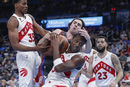 Nov 11, 2022; Oklahoma City, Oklahoma, USA; Oklahoma City Thunder guard Josh Giddey, back and Toronto Raptors forward O.G. Anunoby, front, fight for a loose ball during the second half at Paycom Center. Oklahoma City won 132-113. Mandatory Credit: Alonzo Adams-USA TODAY Sports