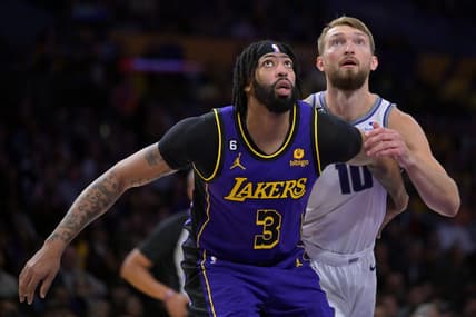 Nov 11, 2022; Los Angeles, California, USA;  Sacramento Kings forward Domantas Sabonis (10) guards Los Angeles Lakers forward Anthony Davis (3) wait for a rebound in the first half at Crypto.com Arena. Mandatory Credit: Jayne Kamin-Oncea-USA TODAY Sports