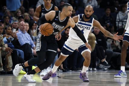 Nov 11, 2022; Memphis, Tennessee, USA; Memphis Grizzlies forward Dillon Brooks (24) dribbles as Minnesota Timberwolves guard Jordan McLaughlin (6) defends during the second half at FedExForum. Mandatory Credit: Petre Thomas-USA TODAY Sports