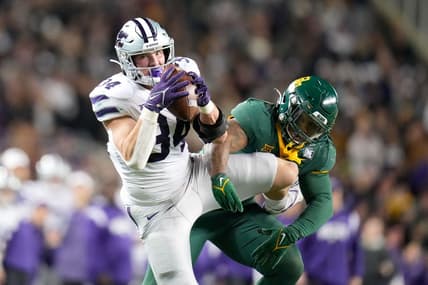 Nov 12, 2022; Waco, Texas, USA;  Kansas State Wildcats tight end Ben Sinnott (34) catches the ball as Baylor Bears linebacker Jackie Marshall (35) defends during the first half at McLane Stadium. Mandatory Credit: Chris Jones-USA TODAY Sports