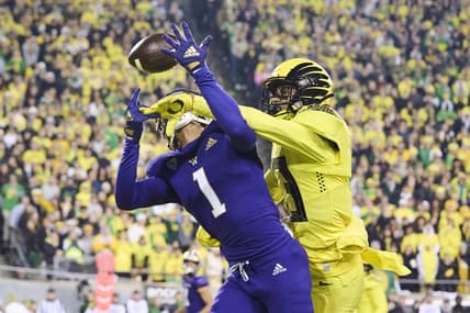 Nov 12, 2022; Eugene, Oregon, USA; Oregon Ducks defensive back Bryan Addison (13) breaks up a pass during the second half intended for Washington Huskies wide receiver Rome Odunze (1) at Autzen Stadium. The Huskies won the game 37-34. Mandatory Credit: Troy Wayrynen-USA TODAY Sports