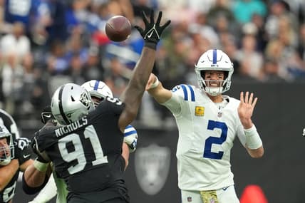 Nov 13, 2022; Paradise, Nevada, USA; Indianapolis Colts quarterback Matt Ryan (2) attempts a pass as Las Vegas Raiders defensive tackle Bilal Nichols (91) looks to deflect the play during the first half at Allegiant Stadium. Mandatory Credit: Stephen R. Sylvanie-USA TODAY Sports