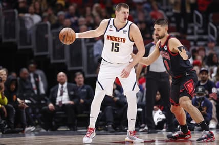 Nov 13, 2022; Chicago, Illinois, USA; Chicago Bulls center Nikola Vucevic (9) defends against Denver Nuggets center Nikola Jokic (15) during the first half at United Center. Mandatory Credit: Kamil Krzaczynski-USA TODAY Sports