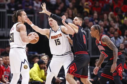 Nov 13, 2022; Chicago, Illinois, USA; Chicago Bulls center Nikola Vucevic (9) defends against Denver Nuggets center Nikola Jokic (15) during the first half at United Center. Mandatory Credit: Kamil Krzaczynski-USA TODAY Sports