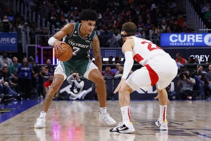 Nov 14, 2022; Detroit, Michigan, USA;  Detroit Pistons guard Killian Hayes (7) dribbles defended by Toronto Raptors guard Malachi Flynn (22) in the second half at Little Caesars Arena. Mandatory Credit: Rick Osentoski-USA TODAY Sports