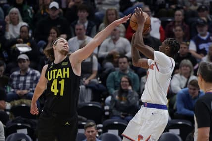 Nov 15, 2022; Salt Lake City, Utah, USA;  Utah Jazz forward Kelly Olynyk (41) tries to block the shot of New York Knicks forward Cam Reddish (0) during the second half at Vivint Arena. Mandatory Credit: Chris Nicoll-USA TODAY Sports