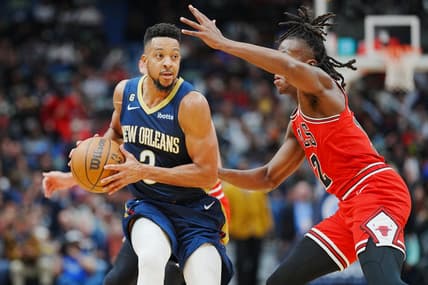 Nov 16, 2022; New Orleans, Louisiana, USA; New Orleans Pelicans guard CJ McCollum (3) fights for position against Chicago Bulls guard Ayo Dosunmu (12) during the second quarter at Smoothie King Center. Mandatory Credit: Andrew Wevers-USA TODAY Sports