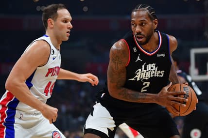 Nov 17, 2022; Los Angeles, California, USA; Los Angeles Clippers forward Kawhi Leonard (2) controls the ball against Detroit Pistons forward Bojan Bogdanovic (44) during the first half at Crypto.com Arena. Mandatory Credit: Gary A. Vasquez-USA TODAY Sports
