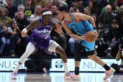 Nov 18, 2022; Salt Lake City, Utah, USA; Phoenix Suns guard Devin Booker (1) looks to drive the ball against Utah Jazz forward Jarred Vanderbilt (8) in the second quarter at Vivint Arena. Mandatory Credit: Rob Gray-USA TODAY Sports