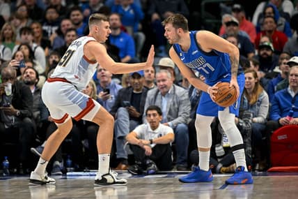 Nov 18, 2022; Dallas, Texas, USA; Denver Nuggets forward Vlatko Cancar (31) defends against Dallas Mavericks guard Luka Doncic (77) during the second half at the American Airlines Center. Mandatory Credit: Jerome Miron-USA TODAY Sports