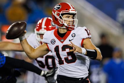Nov 19, 2022; Lexington, Kentucky, USA; Georgia Bulldogs quarterback Stetson Bennett (13) passes the ball against the Kentucky Wildcats during the third quarter at Kroger Field. Mandatory Credit: Jordan Prather-USA TODAY Sports