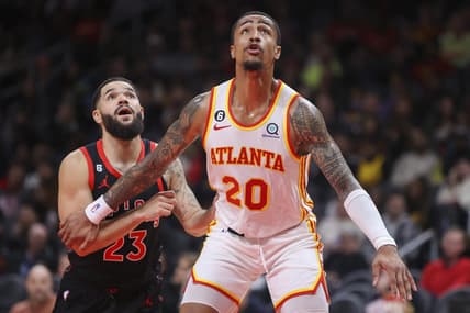 Nov 19, 2022; Atlanta, Georgia, USA; Atlanta Hawks forward John Collins (20) boxes out Toronto Raptors guard Fred VanVleet (23) in the second quarter at State Farm Arena. Mandatory Credit: Brett Davis-USA TODAY Sports