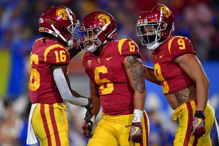 Nov 19, 2022; Pasadena, California, USA; Southern California Trojans running back Austin Jones (6) celebrates his touchdown scored against the UCLA Bruins with wide receiver Tahj Washington (16) and wide receiver Michael Jackson III (9) during the first half at the Rose Bowl. Mandatory Credit: Gary A. Vasquez-USA TODAY Sports