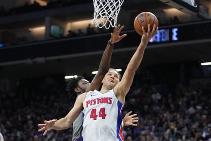 November 20, 2022; Sacramento, California, USA; Detroit Pistons forward Bojan Bogdanovic (44) shoots the basketball against Sacramento Kings forward Chimezie Metu (7) during the second quarter at Golden 1 Center. Mandatory Credit: Kyle Terada-USA TODAY Sports