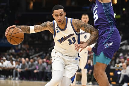 Nov 20, 2022; Washington, District of Columbia, USA; Washington Wizards forward Kyle Kuzma (33) dribbles as Charlotte Hornets forward P.J. Washington (25) defends during the first half at Capital One Arena. Mandatory Credit: Brad Mills-USA TODAY Sports