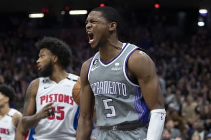 November 20, 2022; Sacramento, California, USA; Sacramento Kings guard De'Aaron Fox (5) celebrates after dunking the basketball against Detroit Pistons forward Marvin Bagley III (35) during the fourth quarter at Golden 1 Center. Mandatory Credit: Kyle Terada-USA TODAY Sports