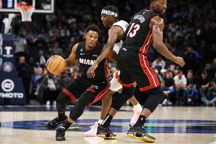 Nov 21, 2022; Minneapolis, Minnesota, USA; Miami Heat guard Kyle Lowry (7) dribbles the ball while Minnesota Timberwolves forward Jaden McDaniels (3) defends during the first quarter at Target Center. Mandatory Credit: Matt Krohn-USA TODAY Sports