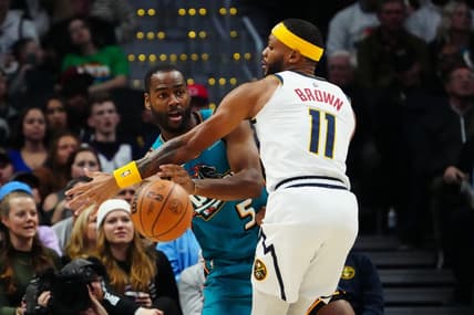 Nov 22, 2022; Denver, Colorado, USA; Detroit Pistons guard Alec Burks (5) passes the ball around Denver Nuggets forward Bruce Brown (11) in the second quarter at Ball Arena. Mandatory Credit: Ron Chenoy-USA TODAY Sports
