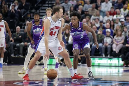 Nov 23, 2022; Salt Lake City, Utah, USA;  Detroit Pistons forward Bojan Bogdanovic (44) keeps the ball away from Utah Jazz guard Collin Sexton (2) during the second half at Vivint Arena. Mandatory Credit: Chris Nicoll-USA TODAY Sports