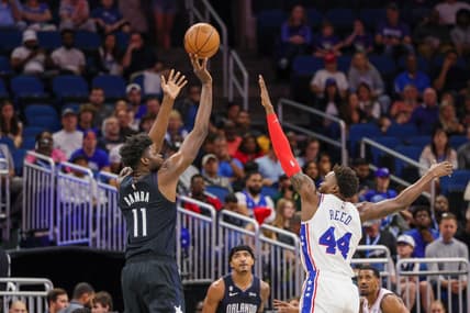 Nov 25, 2022; Orlando, Florida, USA; Orlando Magic center Mo Bamba (11) shoots the ball over Philadelphia 76ers forward Paul Reed (44) during the first quarter at Amway Center. Mandatory Credit: Mike Watters-USA TODAY Sports