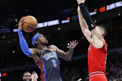 Nov 25, 2022; Oklahoma City, Oklahoma, USA; Oklahoma City Thunder guard Shai Gilgeous-Alexander (2) is defended by Chicago Bulls center Nikola Vucevic (9) on a drive during the second quarter at Paycom Center. Mandatory Credit: Alonzo Adams-USA TODAY Sports