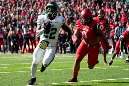 Tulane Green Wave running back Tyjae Spears (22)  beats Cincinnati Bearcats linebacker Ivan Pace Jr. (0) on a touchdown run in the second quarter during a college football game, Friday, Nov. 25, 2022, at Nippert Stadium in Cincinnati.

Ncaaf Tulane Green Wave At Cincinnati Bearcats Nov 25 0162