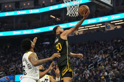 Nov 25, 2022; San Francisco, California, USA; Golden State Warriors guard Stephen Curry (30) shoots against Utah Jazz guards Nickeil Alexander-Walker (6) and Talen Horton-Tucker (0) during the first quarter at Chase Center. Mandatory Credit: Darren Yamashita-USA TODAY Sports