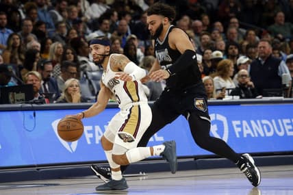 Nov 25, 2022; Memphis, Tennessee, USA; New Orleans Pelicans guard Jose Alvarado (15) dribbles up the court as Memphis Grizzlies forward David Roddy (27) defends during the second half at FedExForum. Mandatory Credit: Petre Thomas-USA TODAY Sports